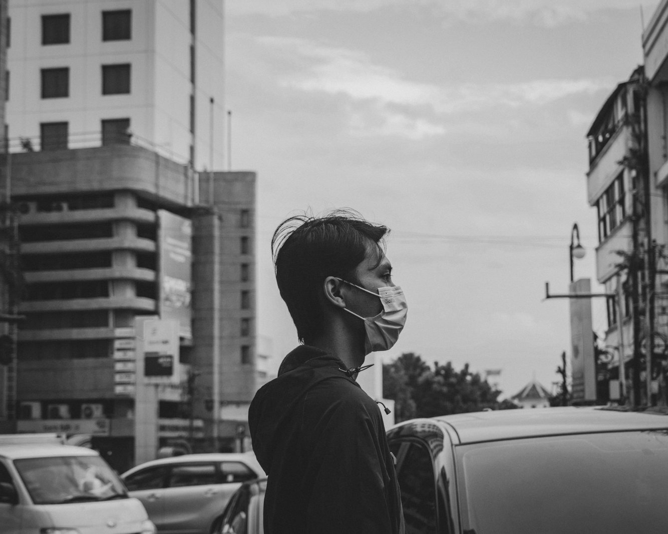 Air quality regulations Bangladesh — heavy traffic and diesel buses on a congested city road
