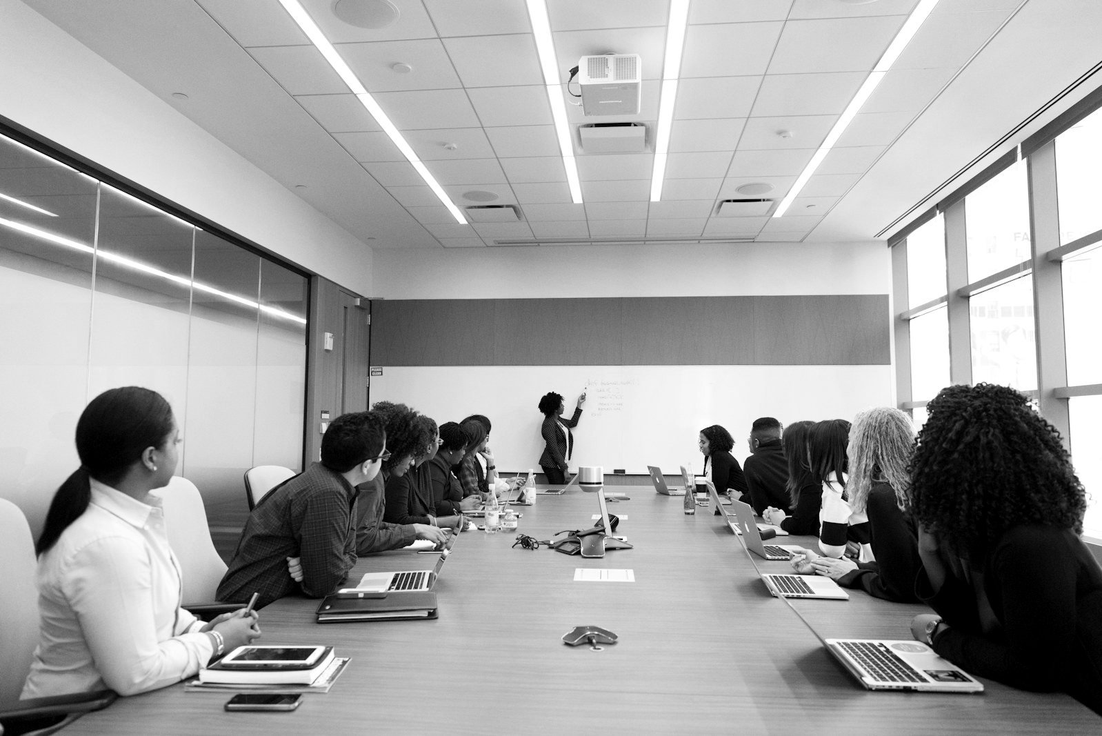 Arbitration vs litigation Bangladesh — counsel weighing forum options across a boardroom table