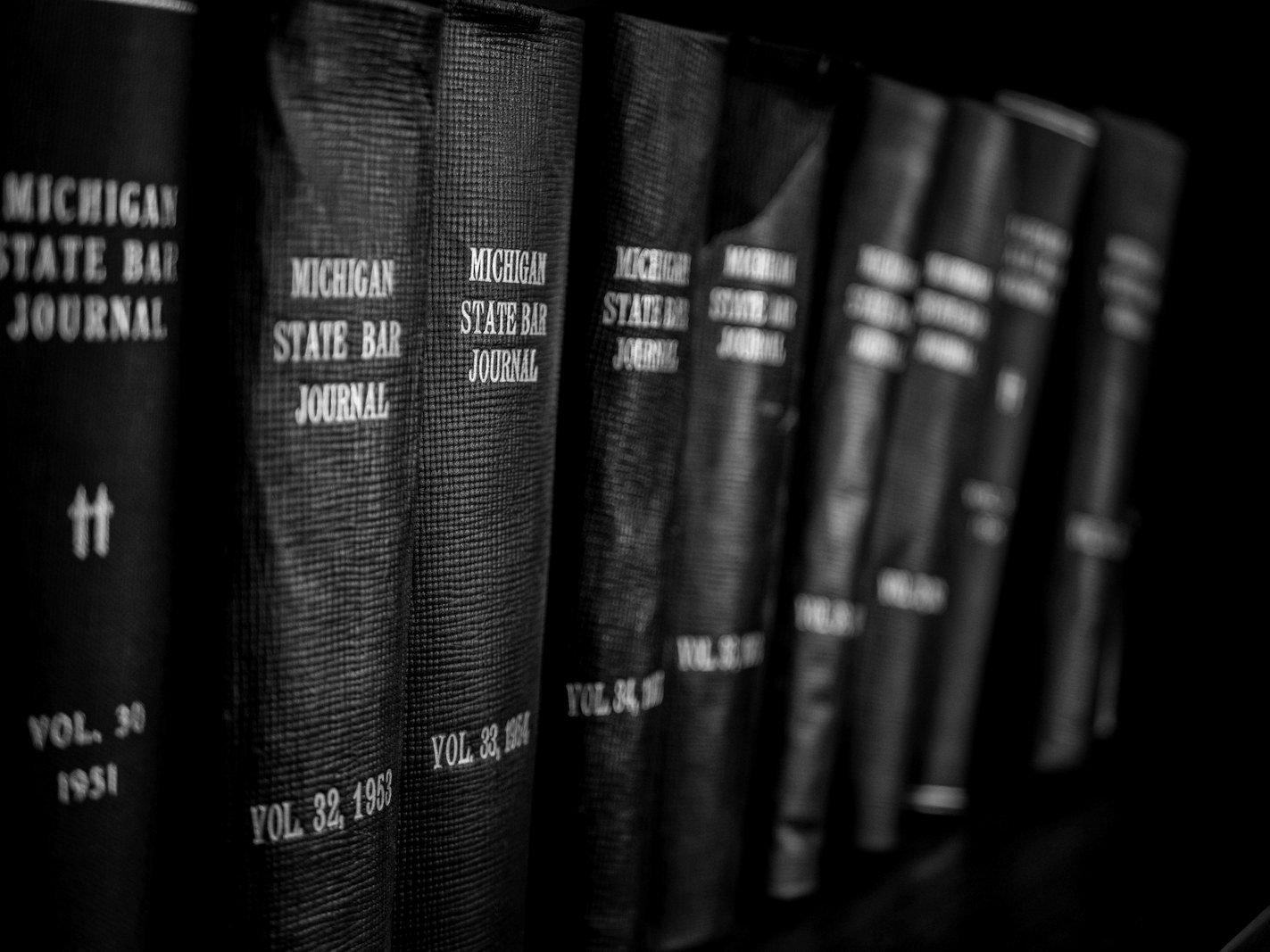 Banking litigation Bangladesh — lawyer reviewing loan files and bank statements