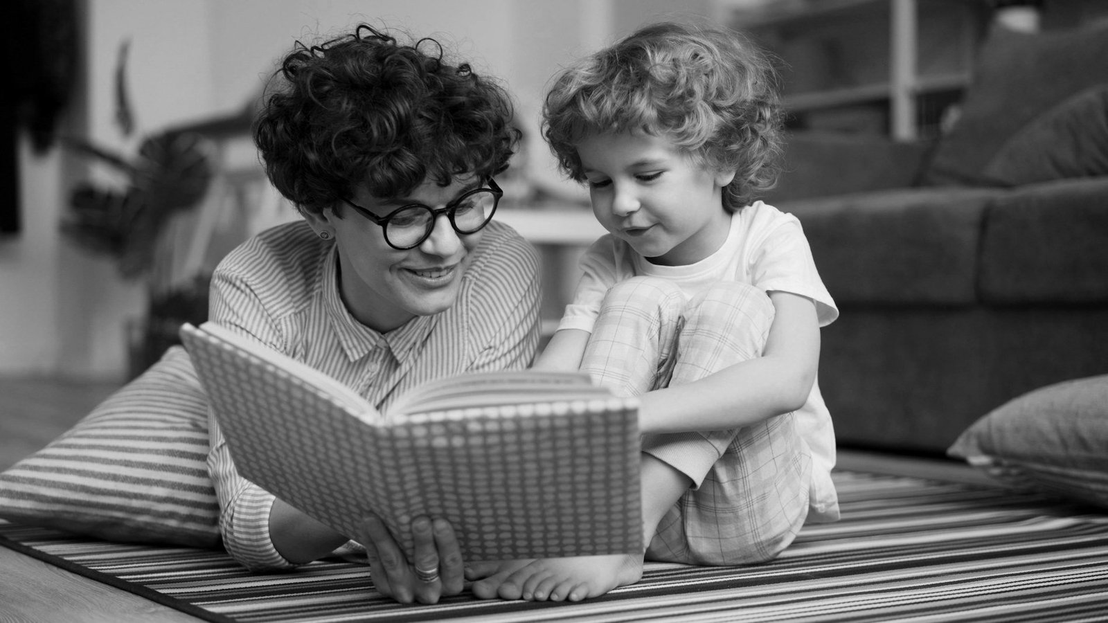 Child custody law in Bangladesh — mother reading with her young daughter at home