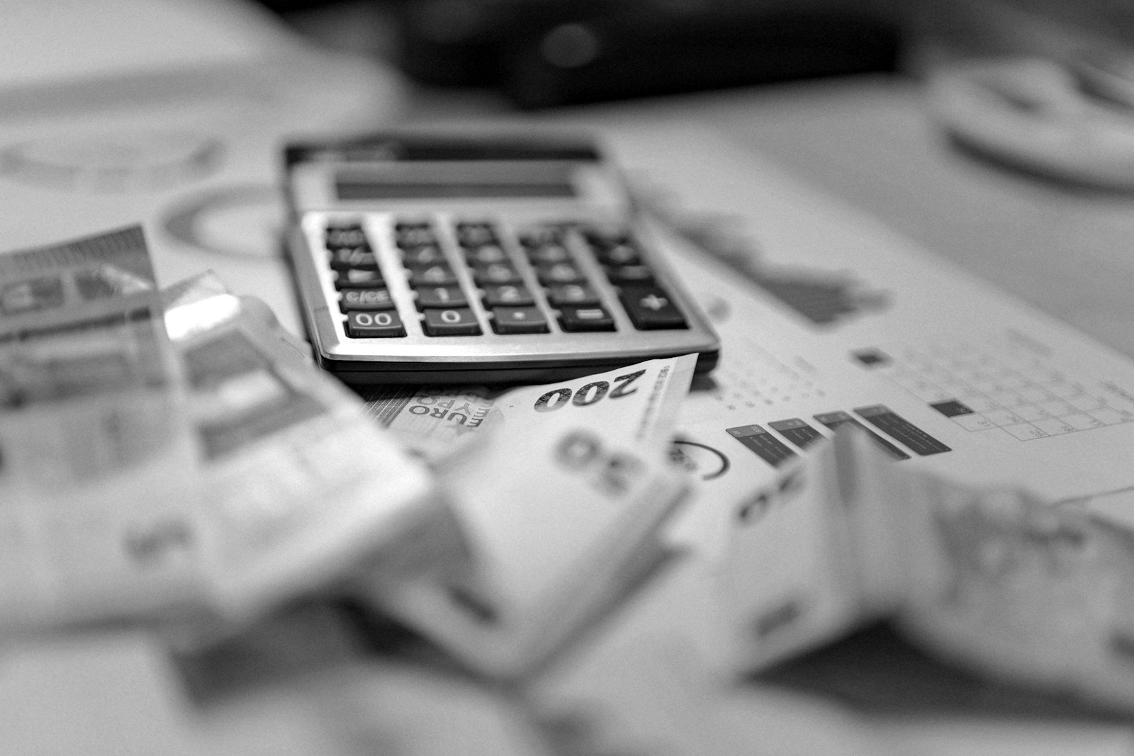 Company registration fees Bangladesh — founder calculating incorporation costs with a calculator and documents