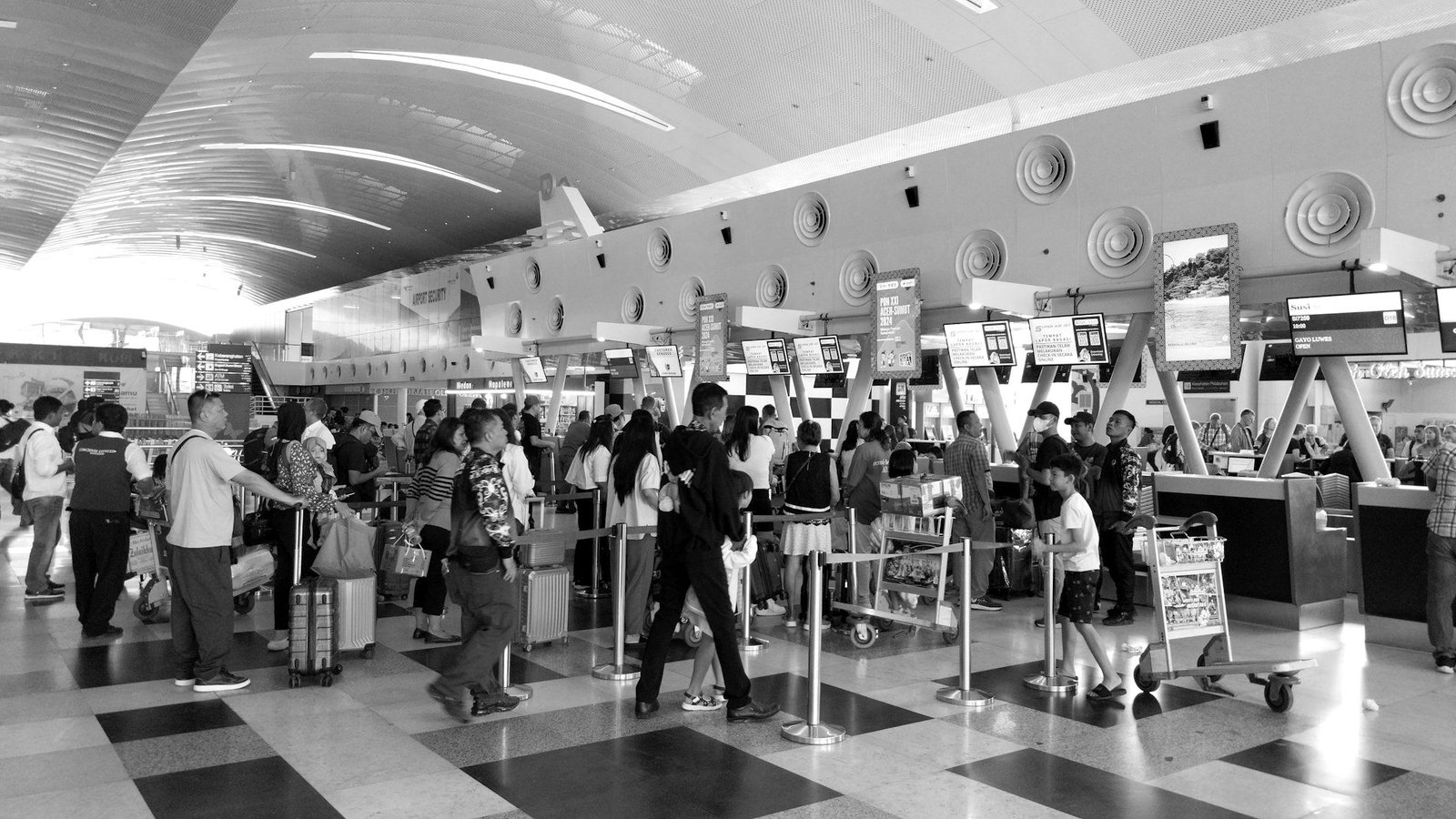 Excise duty in Bangladesh — passengers at an airport check-in counter buying air tickets