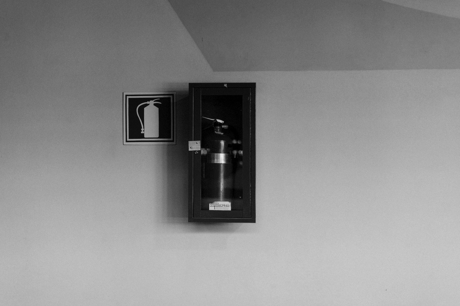 Fire license Bangladesh — fire extinguishers and safety signage in an industrial warehouse