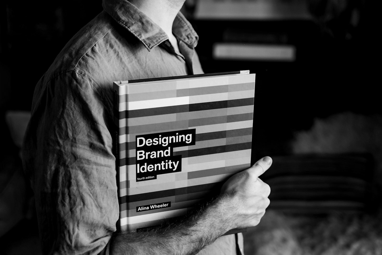 Franchising Bangladesh — brand manual and trademark documents on a desk