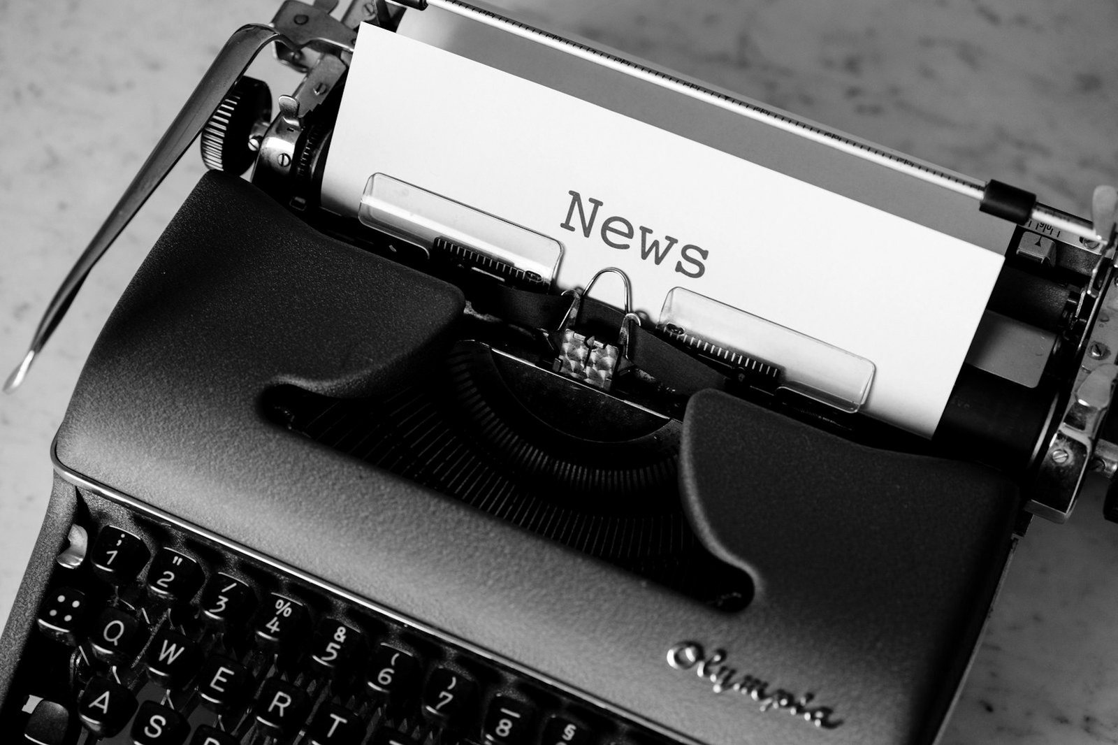 Freedom of expression writ in Bangladesh — journalist writing at a newsroom desk