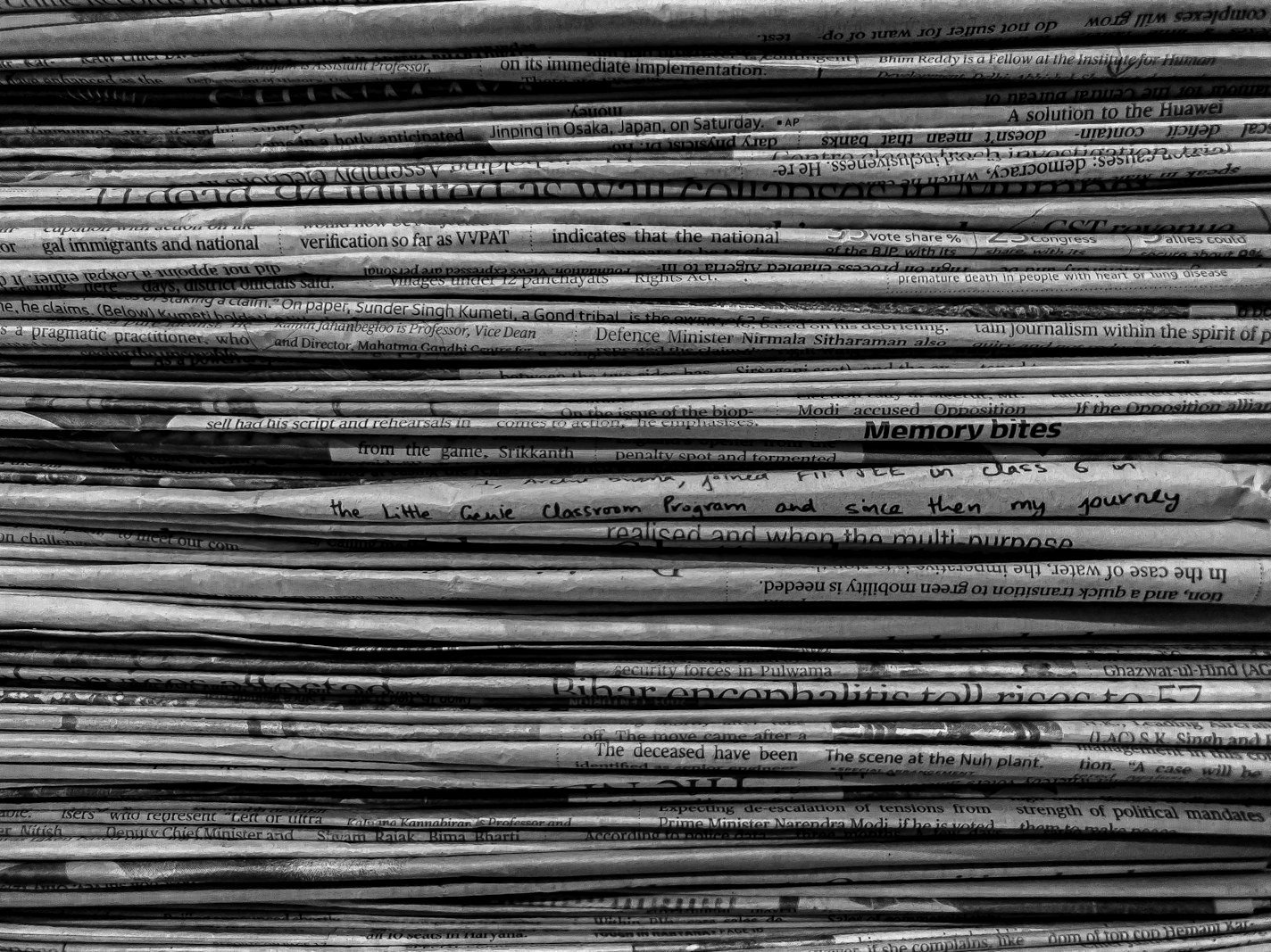 Freedom of expression writ in Bangladesh — newspapers stacked at a press stand