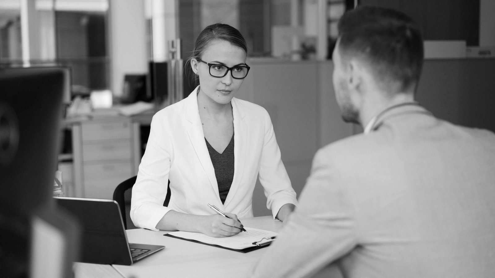 Hiring and firing laws Bangladesh — HR manager handing an appointment letter to a new worker