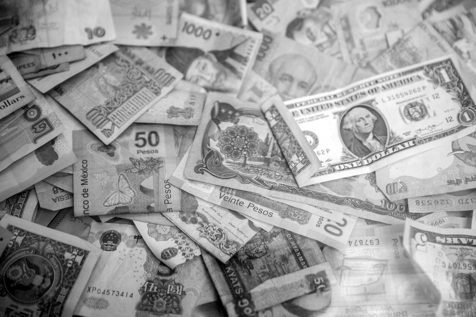How to invest in Bangladesh — banker reviewing foreign exchange remittance documents
