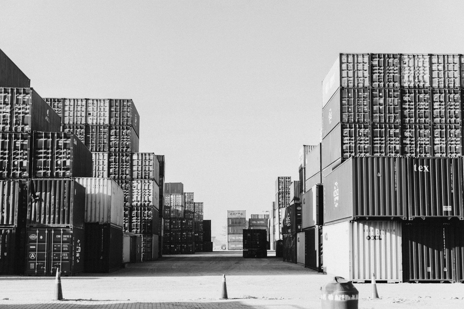 Import duty Bangladesh — container stacks at a seaport awaiting customs assessment