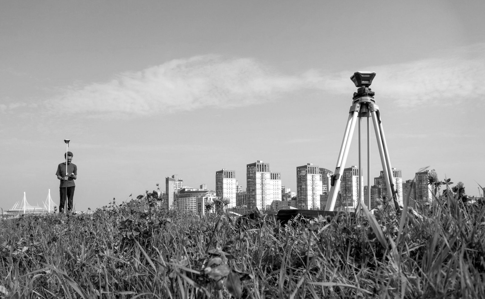 Khatian correction Bangladesh — surveyor measuring land during field survey and attestation