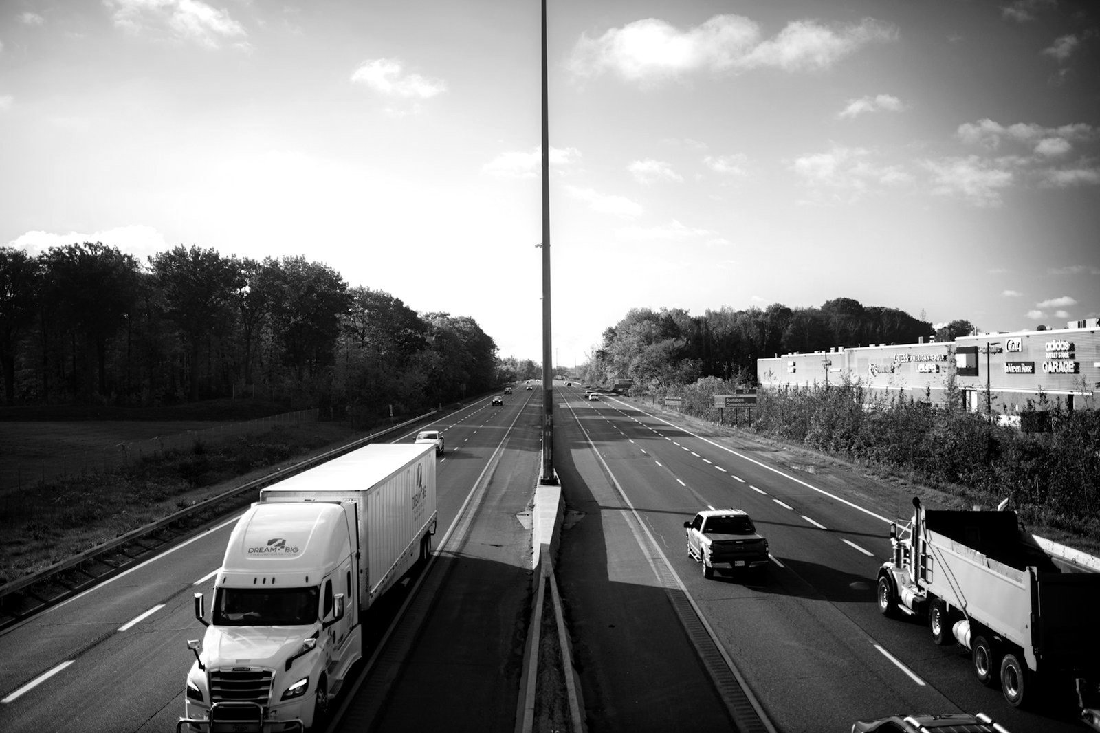 Logistics law in Bangladesh — container trucks queuing on a highway to Chattogram