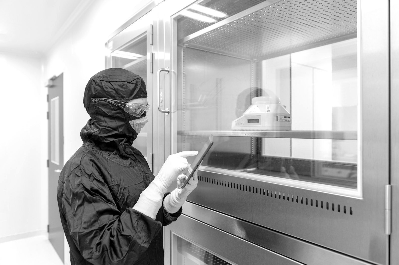 Pharmaceutical company registration Bangladesh — technician inspecting tablets on a pharmaceutical production line