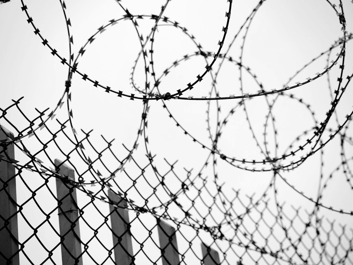 Prisoners rights writ — barbed wire and prison wall symbolising prolonged under-trial detention