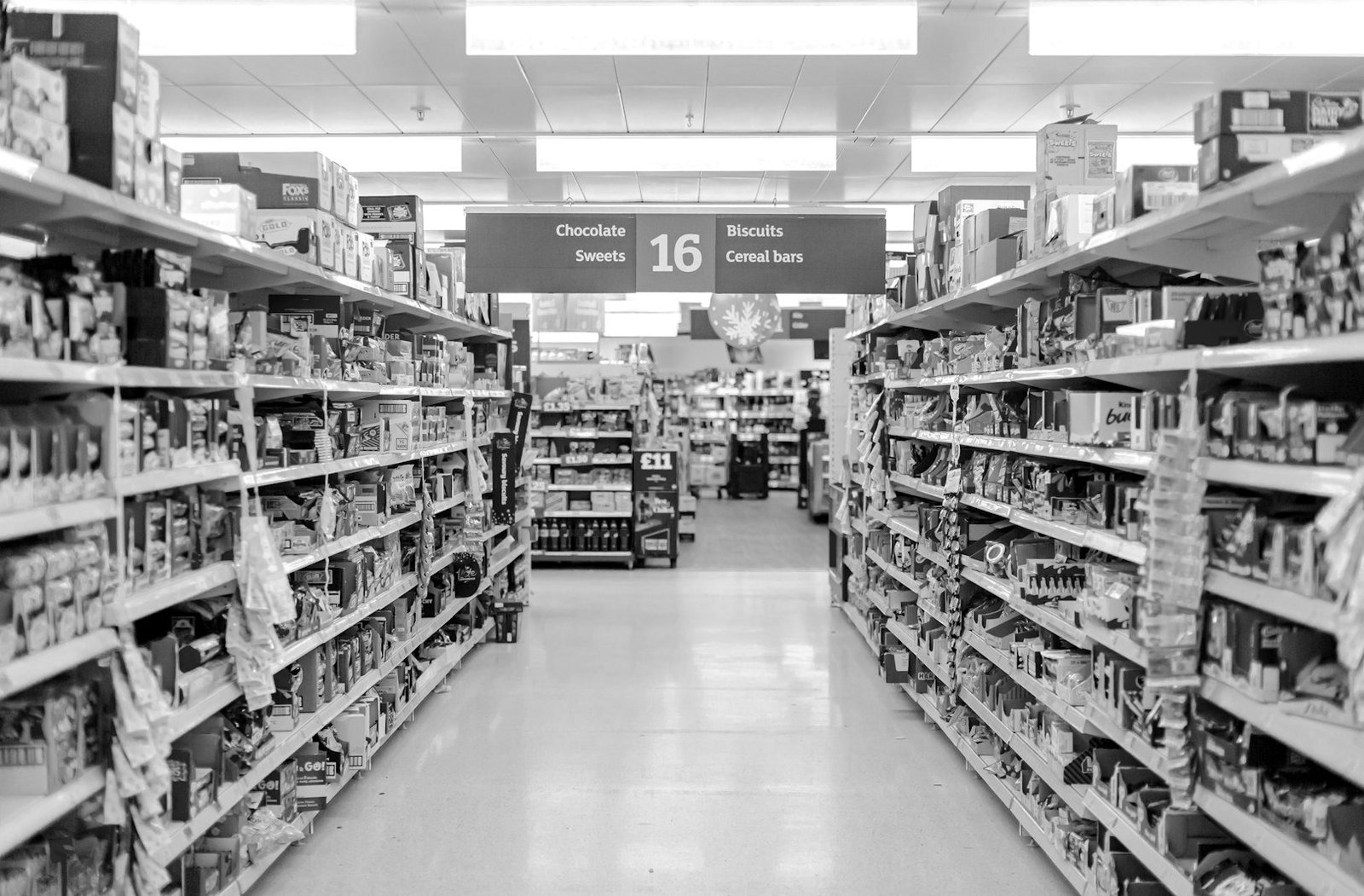 Product liability law Bangladesh — shopper examining a packaged product label in a store