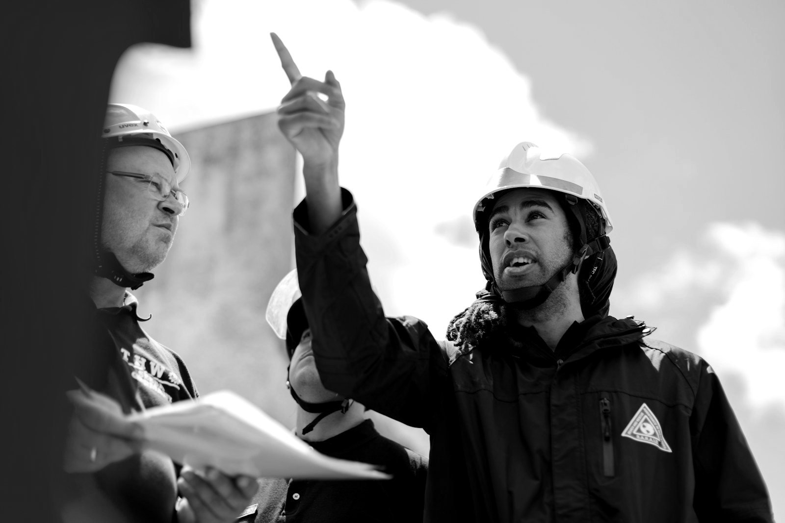 Relocating a factory in Bangladesh — project team reviewing a permit register and site plans