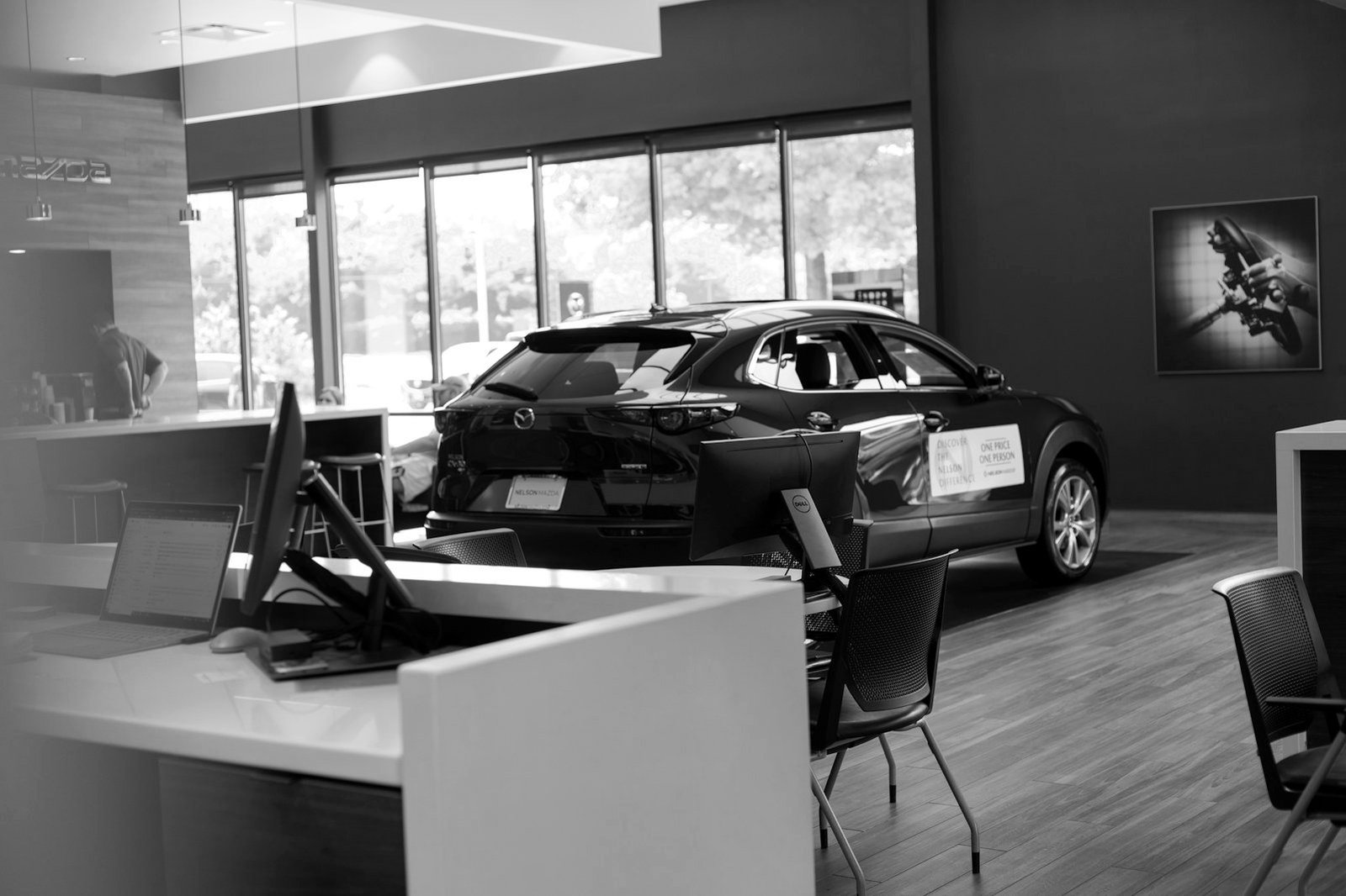 Service business registration Bangladesh — cars lined up at a dealership showroom