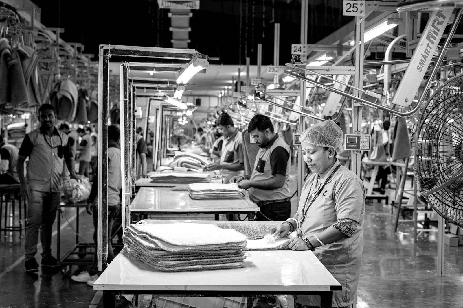 Social security law Bangladesh — garment workers on a factory floor covered by employer benefits