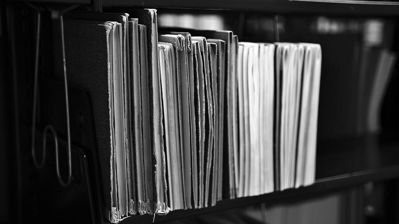 Supreme court case search Bangladesh — advocate reviewing case numbers and party names in a file register