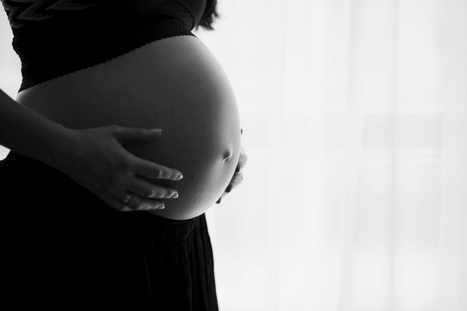 Surrogacy law Bangladesh — expectant mother holding her pregnant belly