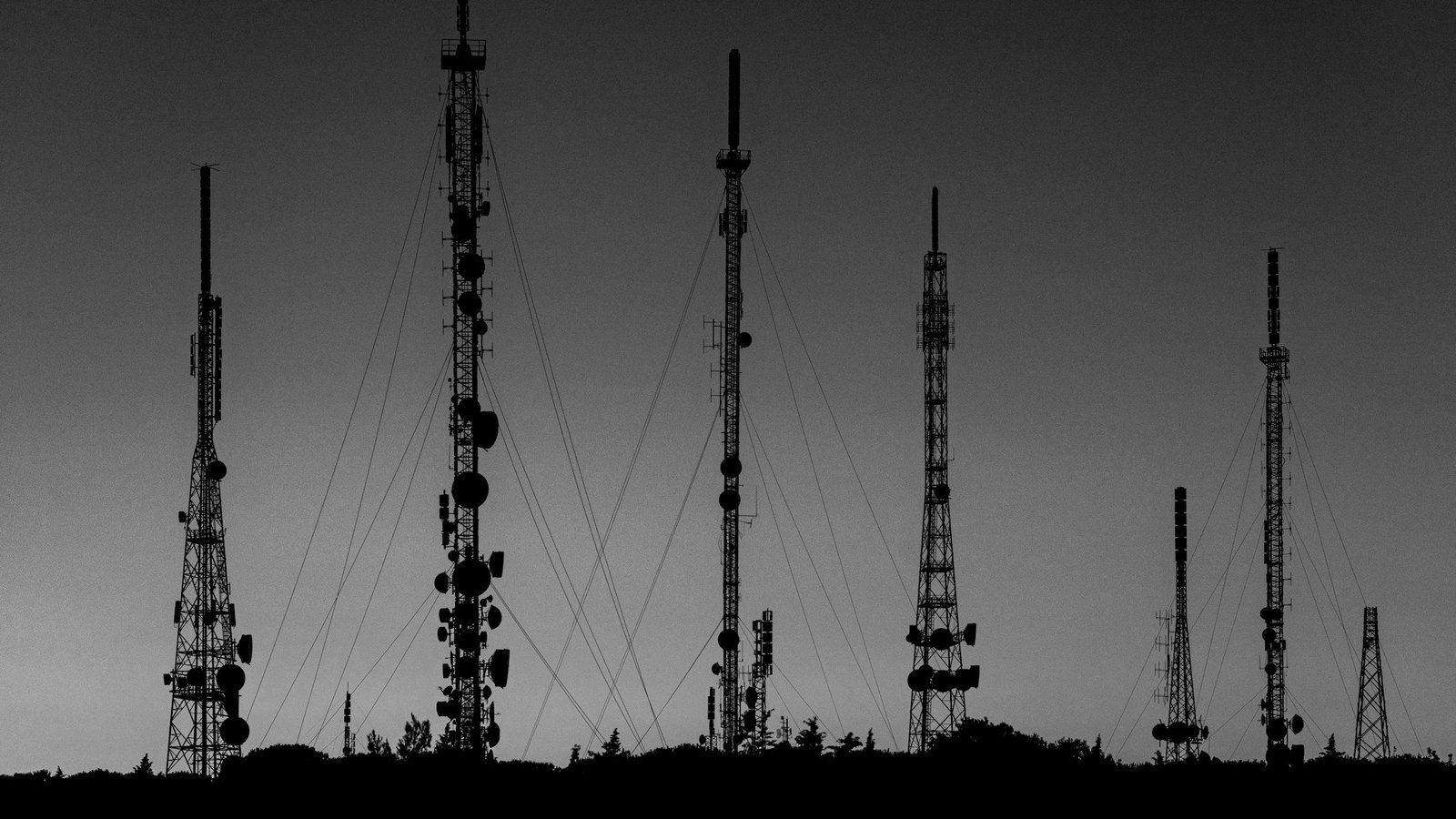 Telecommunications law Bangladesh — mobile network tower against the Dhaka skyline
