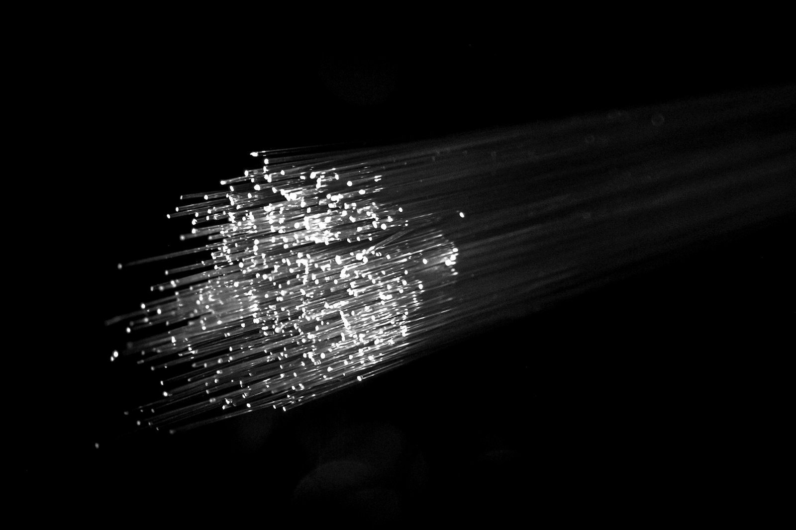 Telecommunications law Bangladesh — engineer working on fibre optic cabling for a licensed network