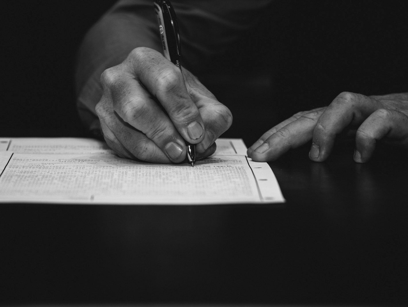 Warrant recall petition Bangladesh — advocate reviewing the order sheet and warrant before a surrender hearing