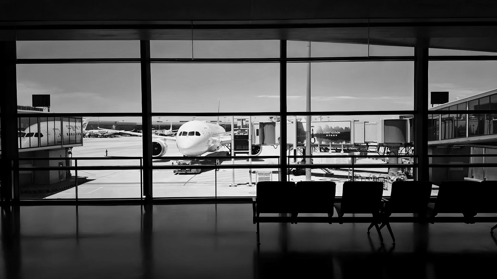 Wilful defaulter in Bangladesh — passport and boarding pass at an airport departure gate
