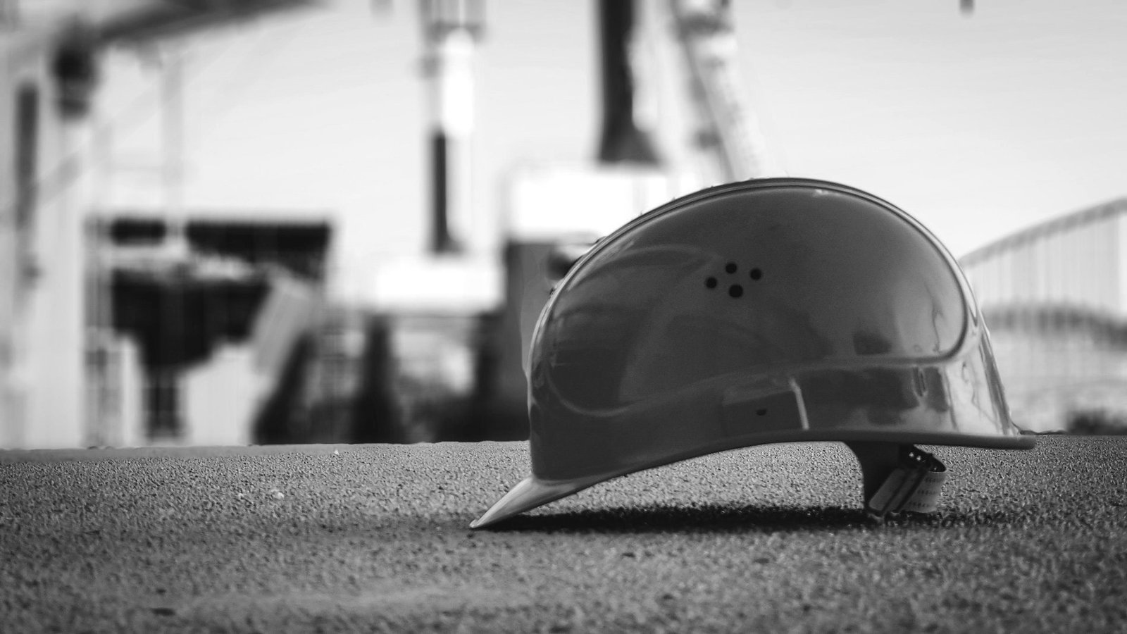 Workers rights in Bangladesh — worker in a hard hat and safety vest on an industrial site