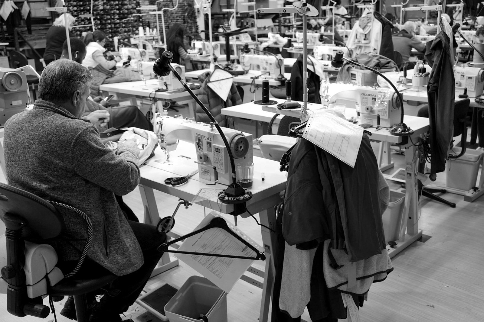 Working hours overtime Bangladesh — garment factory floor with workers on a production shift