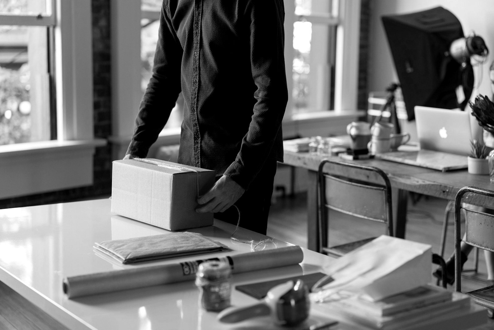 Wrongful dismissal Bangladesh — employee reading a termination letter at a desk